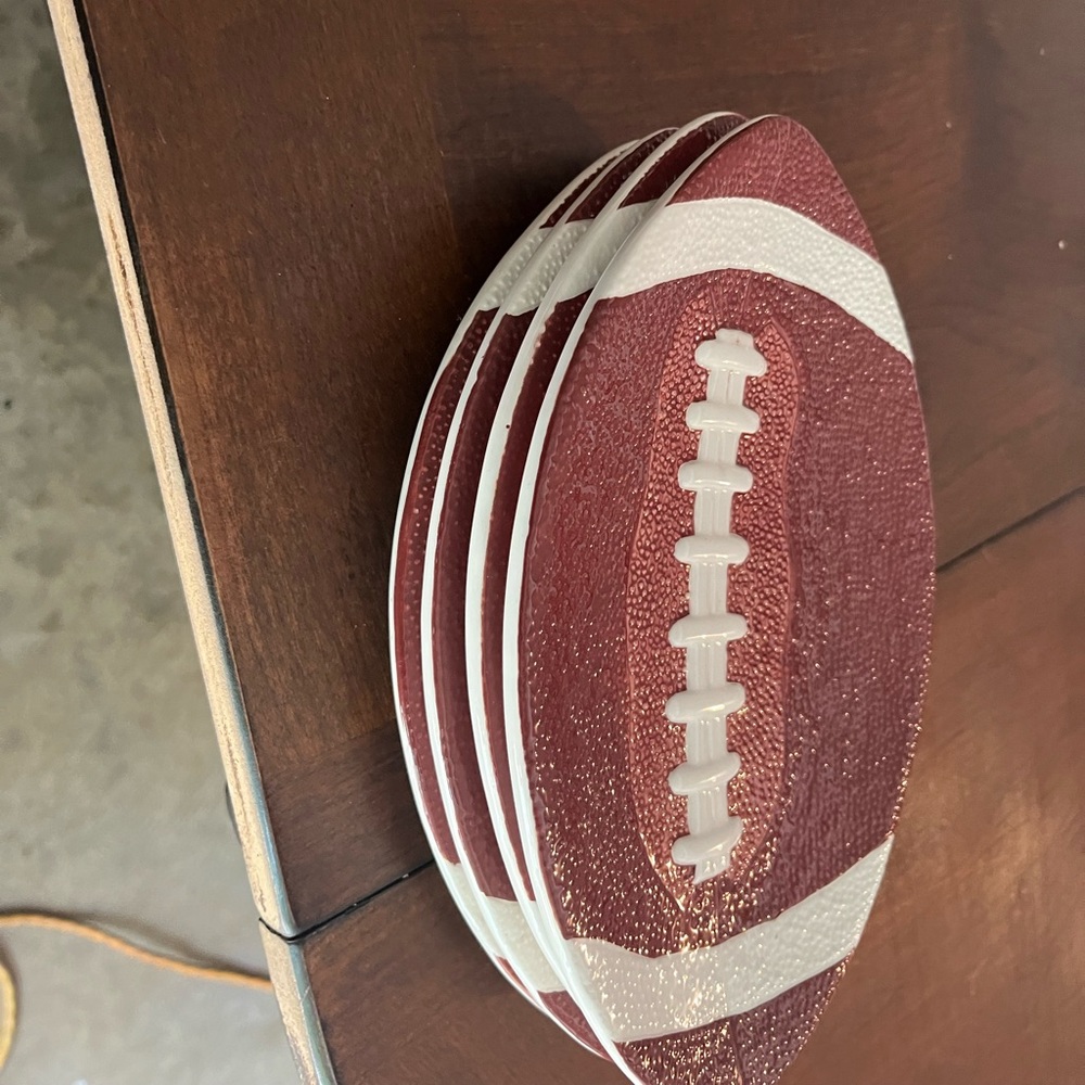 Four football saucer dishes